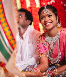 Bride getting ready with wedding makeup artist in Vijayawada