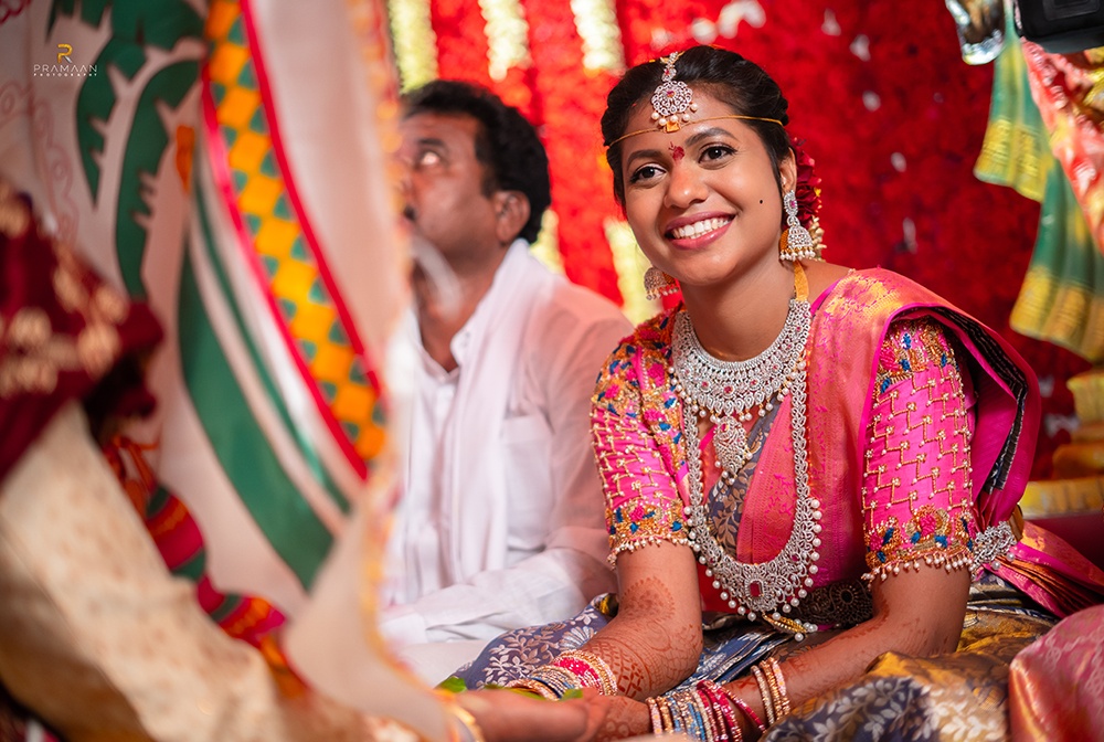 Bride getting ready with wedding makeup artist in Vijayawada