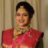 Bride getting makeup done by top makeup artist in Vijayawada at Lush Makeovers studio