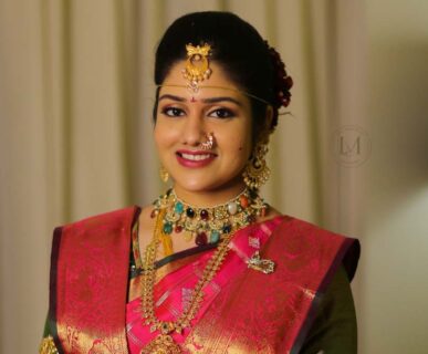 Bride getting makeup done by top makeup artist in Vijayawada at Lush Makeovers studio