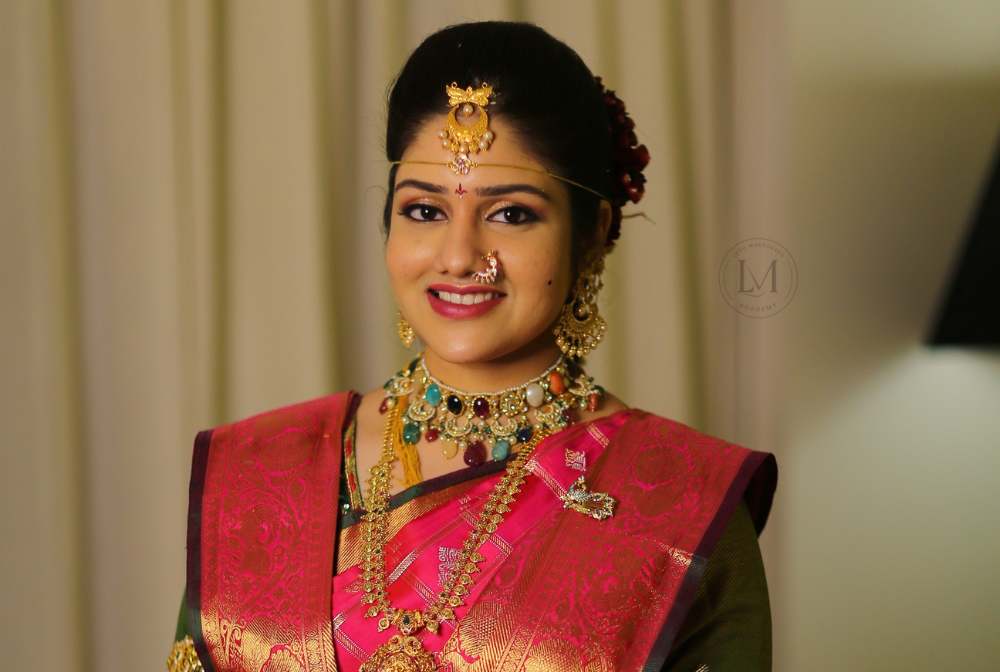 Bride getting makeup done by top makeup artist in Vijayawada at Lush Makeovers studio