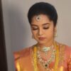 Professional saree stylist draping a South Indian bridal saree in Vijayawada