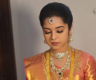 Professional saree stylist draping a South Indian bridal saree in Vijayawada