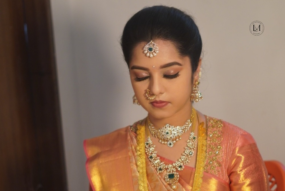 Professional saree stylist draping a South Indian bridal saree in Vijayawada